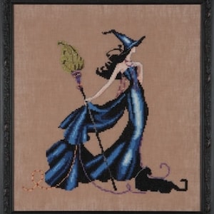 May include: A cross-stitch pattern featuring a witch in a blue dress and a pointed hat, holding a broom. The witch is standing on a tan background with a black cat sitting behind her.