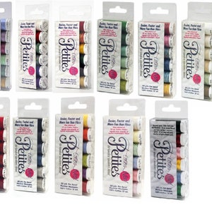 May include: Ten packs of cotton embroidery floss in a variety of colours. Each pack contains six spools of floss and is labelled "Petites Easier, Faster and More Fun than Floss".