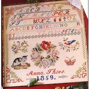 May include: A vintage sampler with a colorful alphabet, numbers, and symbols, including a cat, a bird, a butterfly, and a wreath of roses. The sampler is signed "Anna. Thies. 1859."