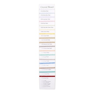 May include: A color chart showing 18 different shades of Crystal Braid thread. The thread is a mix of 45% nylon and 55% rayon. The chart is labeled with the color name and code for each shade.
