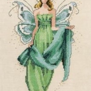 May include: A green fairy with butterfly wings and a flowing gown. She is wearing a flower crown and holding a green scarf.