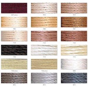 May include: A colour chart of embroidery floss with a variety of colours, including red, brown, beige, white, black, and grey. The floss is arranged in rows and columns, and each colour is labelled with a number.