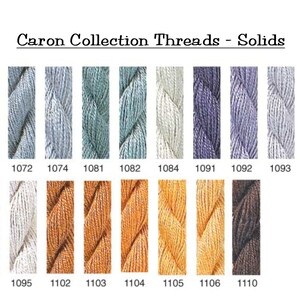 May include: A colour chart of Caron Collection Threads - Solids embroidery floss. The chart shows 12 different colours of floss, with the corresponding colour number listed below each colour. The colours include white, light blue, grey, lavender, brown, and various shades of orange.