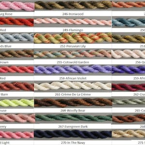 May include: A chart of 30 different colors of embroidery floss, each color is labeled with a number and a name. The floss is wound around a card and displayed in rows of three.