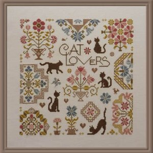 May include: Cross stitch pattern featuring a variety of colourful floral designs and cats. The pattern includes the text "CAT LOVERS".