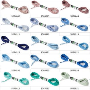 May include: A collection of twenty-five individual skeins of embroidery floss arranged in a grid, each featuring a unique color and a white paper label with a specific product code ranging from SDF4641 to SDF5022 printed in black text.