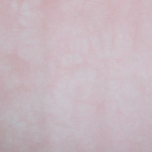 May include: A light pink fabric with a white tie-dye pattern. The fabric has a soft, smooth texture.