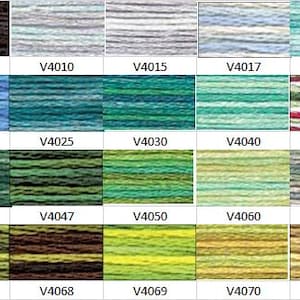 May include: A color chart of yarn samples, showing a variety of colors and patterns. The colors include black, blue, green, brown, and yellow. The patterns include solid colors, stripes, and speckles.