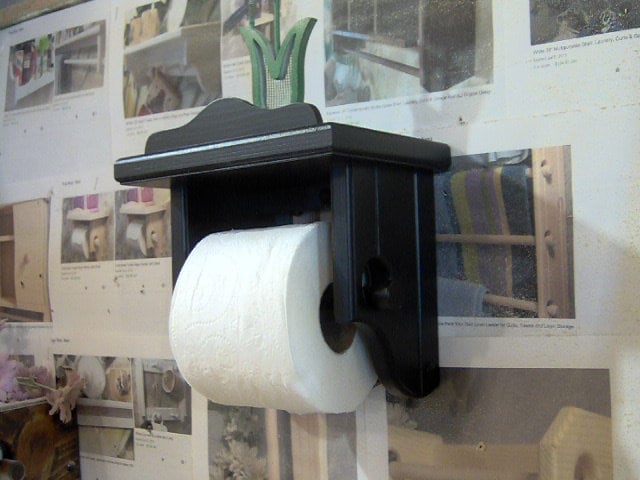 Black toilet paper holder with shelf