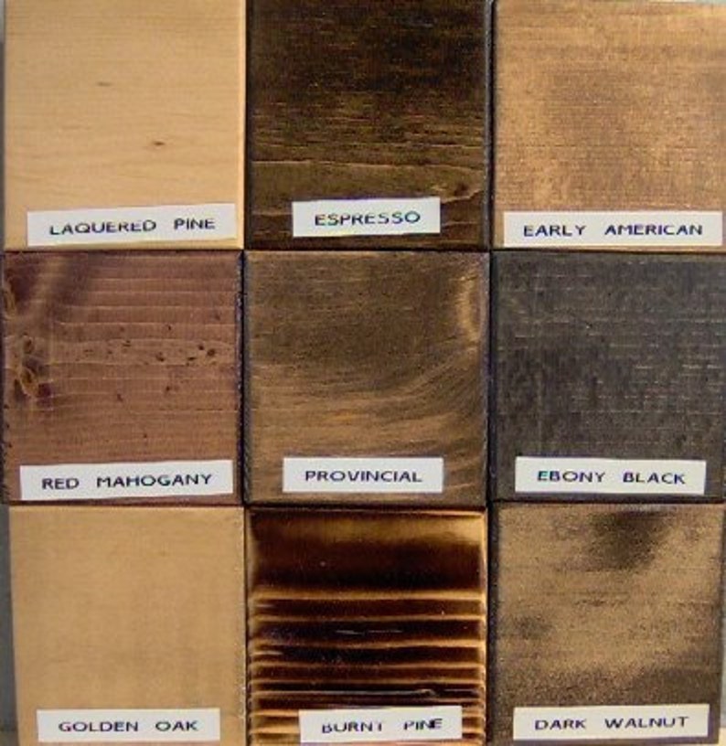 May include: Nine wood stain samples in a grid pattern. The stains are labeled: Lacquered Pine, Espresso, Early American, Red Mahogany, Provincial, Ebony Black, Golden Oak, Burnt Pine, and Dark Walnut.