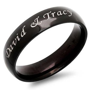 May include: Black stainless steel ring with the inscription "David J Tracy" engraved in silver lettering.