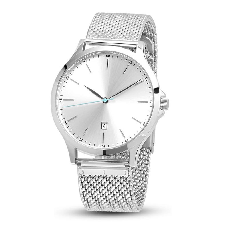 May include: A silver wristwatch with a mesh band. The watch has a round face with a silver dial, black hands, and a date window at the 6 o'clock position. The band is made of a fine, woven metal mesh. The watch is a classic, minimalist design.