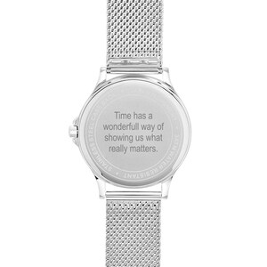 May include: A silver stainless steel watch with a mesh band. The watch face has the text "Time has a wonderful way of showing us what really matters."