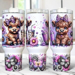 May include: White tumbler featuring a cartoon calf with a purple bow, surrounded by flowers and butterflies. The design includes purple and pink accents, with a leopard print detail on the drink cups. The bottom of the tumbler showcases a floral and butterfly pattern.