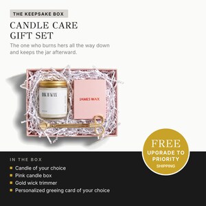 a gift set called "The Keepsake Box Candle Care Gift Set" presented in a pink box with white paper lining. The gift set includes a candle, a pink box, and a gold wick trimmer. The image also includes a free upgrade offer for priority shipping.