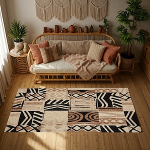 May include: A rectangular area rug with a patchwork design in black, beige, and brown geometric patterns. The rug is placed on a wooden floor in a living room setting, with a rattan sofa and decorative pillows.