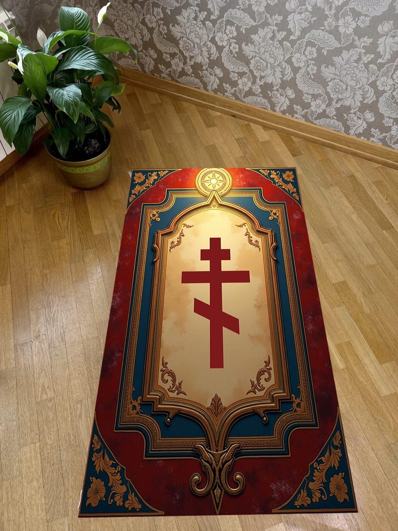 May include: A rectangular prayer rug with a red and gold Orthodox cross design. The rug has a red border with gold floral accents and a blue frame. The center features a cream-colored background with a red cross.