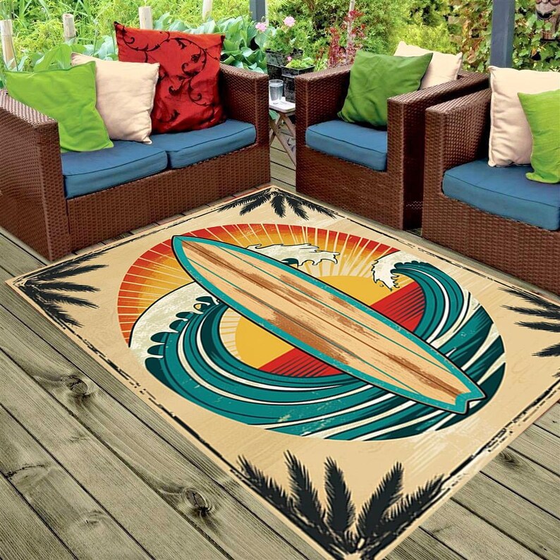 May include: A vintage-style rug with a surfboard and waves in shades of blue, yellow, and red. Palm trees are depicted in black against a beige background.