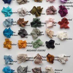 May include: A chart of fabric swatches in various colors, including blue, green, brown, orange, pink, and white. The swatches are labeled with their corresponding color names. The chart also includes a section labeled "Melange Colors" with swatches of blended colors.