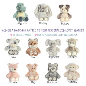 May include: A collection of plush animal toys, including an alligator, bunny, puppy, cow, fox, elephant, giraffe, fawn, pig, raccoon, and monkey. Each toy is approximately 6.5 inches tall. Text on the image reads "ADD ON A MATCHING RATTLE TO YOUR PERSONALIZED LOVEY BLANKET".