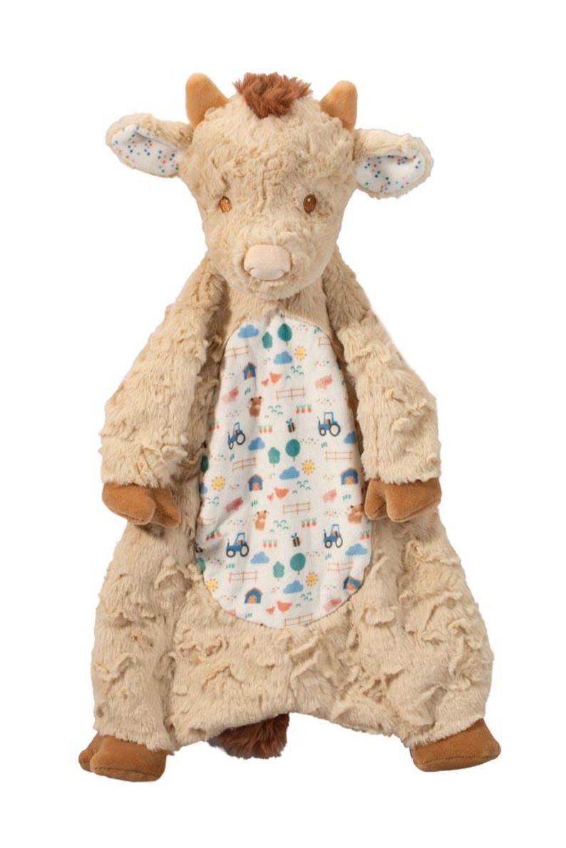 Pu&ograve; includere: Un peluche di mucca delle Highlands color beige con una pancia fantasia. La mucca ha zoccoli, corna e un ciuffo di capelli marroni. La pancia presenta una scena di fattoria con trattori, recinzioni e alberi.