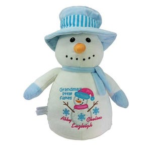 May include: A plush snowman toy with a light blue top hat and scarf. The snowman has a carrot nose, black button eyes, and a stitched mouth. The front of the snowman has an embroidered design with the text "Grandma's Little Flakes" and names.