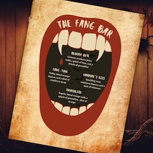 May include: A rectangular menu sign titled The Fang Bar, featuring a large open mouth graphic with white fangs. The black interior lists four cocktail recipes: Bloody Bite, Fang-Tini, Vampire's Kiss, and Draculito, set against a parchment background.