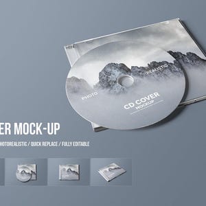 May include: A CD cover mockup with a gray and white mountain landscape design. The CD is in a clear jewel case. The text "CD COVER MOCK-UP" is displayed in white, along with other text.