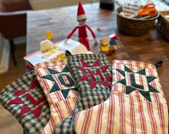 キルティングされた家宝のクリスマスストッキング