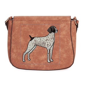 May include: A brown faux leather shoulder bag with a black and white dog illustration on the front. The dog is a German Shorthaired Pointer.