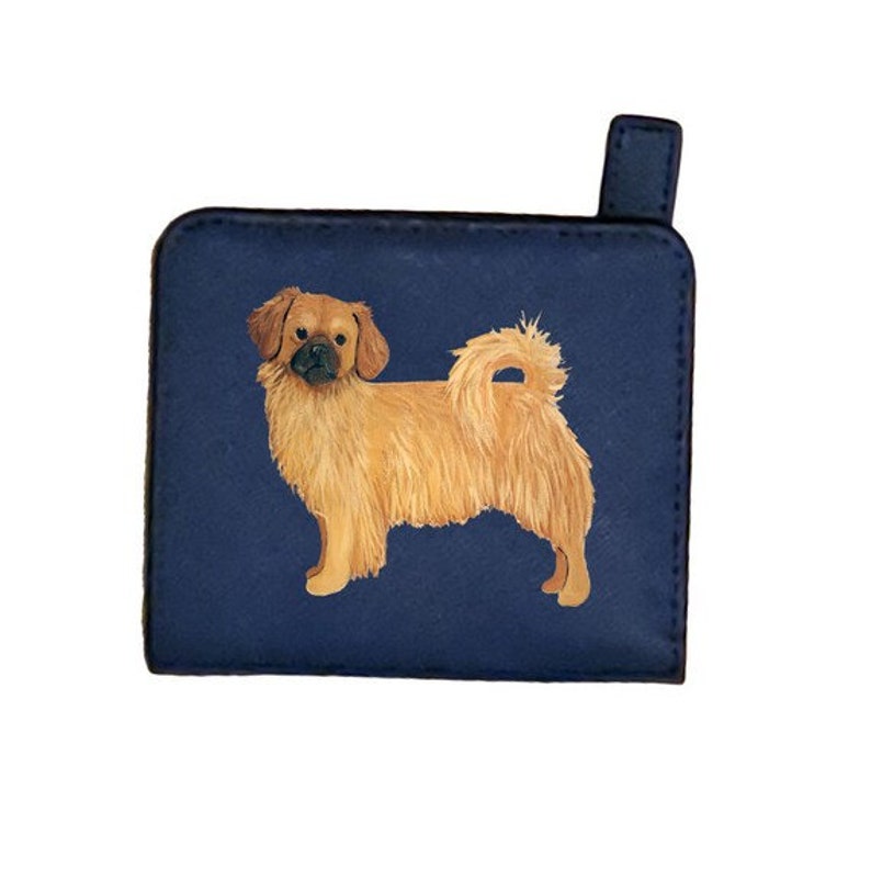 May include: A blue zippered wallet featuring an illustration of a brown and white dog. The dog is standing on all four legs with its tail curled up.