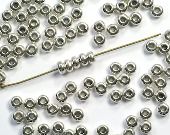 Contas espaçadoras Heishi arredondadas de 4 mm em estanho com banho de prata brilhante - 50 unidades