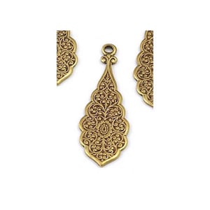 May include: Gold-toned metal pendant with an intricate floral design. The pendant is shaped like a teardrop and has a loop at the top for hanging.