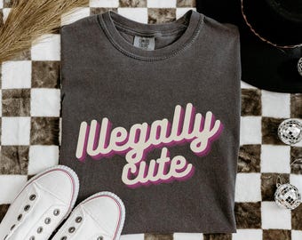 Illegally Cute Graphic T-shirt, Unhinged Oversized Sustainable Tee, Funny Quote Gift for Birthday, Sarcastic Social Commentary Tshirt