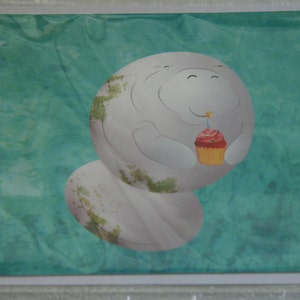Manatee holding cupcake Happy Birthday greeting card