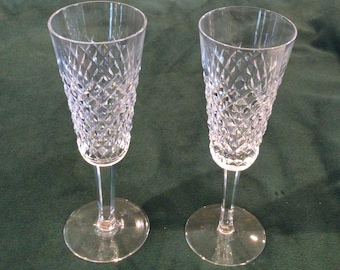 Lovely Pair of Waterford Fluted Crystal Champagne Glasses. Vintage made and stamped “Waterford” on each glass. Stands 7.4” with 2.5” dia.