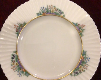 Vintage 1960s Rutledge By Lenox Porcelain Salad Plate with Raised Enamel Floral Decor and 24k gold trim. Measures 8.5” with .5” depth.