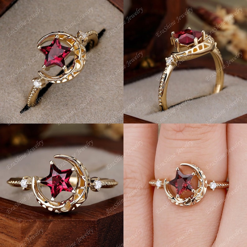 K&ouml;nnte beinhalten: Ein goldener Ring mit einem Halbmond-Design und einem roten sternf&ouml;rmigen Edelstein. Der Ring ist mit kleinen klaren Edelsteinen auf der Band besetzt.