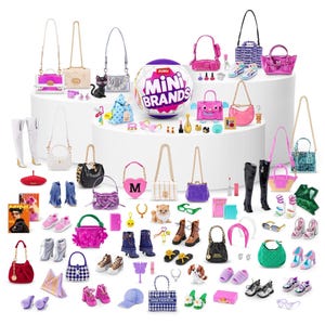 May include: A collection of miniature fashion accessories, including handbags, shoes, boots, and a variety of other items. The items are in various colors, including pink, black, white, and blue. The ZURU Mini Brands ball is also present.