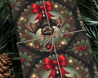 May include: A Christmas-themed gift wrap featuring a black bat with red bows hanging from a wreath of holly and berries. The background is a dark green with gold lights.