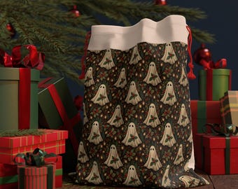 May include: A festive gift bag featuring a repeating pattern of ghost illustrations, holly, and berries on a dark backdrop. The bag has a white top and red drawstring. Presents and a Christmas tree are in the background.