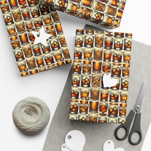 May include: A sheet of wrapping paper with a repeating pattern of brown and yellow glasses filled with a brown liquid. The glasses are surrounded by ice cubes. The paper is wrapped around a gift box with a white star and a white heart.