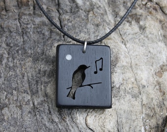 Ebony Wood Songbird Necklace: Wooden Blackbird Pendant With A Mother Of Pearl Inlay