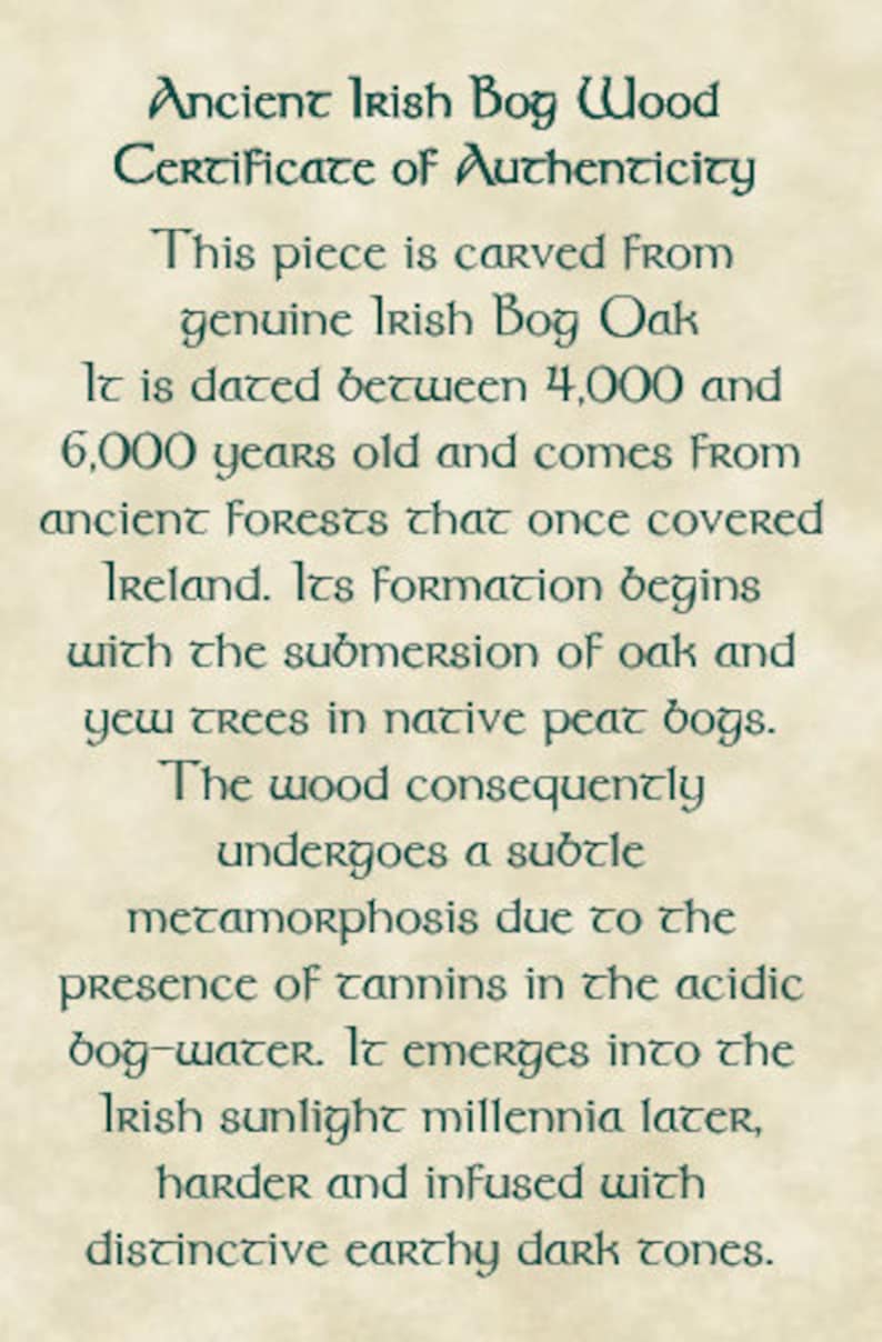 May include: A certificate of authenticity for Ancient Irish Bog Wood. The text describes the wood's origin from Irish Bog Oak, dating back 4,000 to 6,000 years. It details the wood's formation and unique earthy tones.