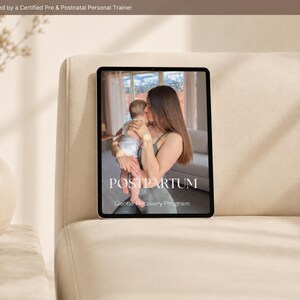 May include: A tablet displaying a digital program titled POSTPARTUM Gentle Recovery Program, featuring an image of a person holding a baby. The top of the screen includes the text Designed by a Certified Pre & Postnatal Personal Trainer.