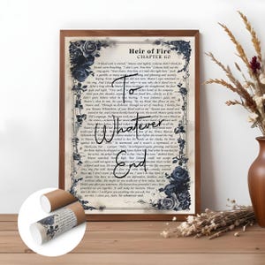 May include: A framed print featuring text and floral decorations. The text reads "Heir of Fire Chapter 60" with the words "Whatever End" in a decorative font. A rolled print with a similar design is in the foreground.