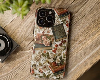 May include: A white phone case with a floral pattern and vintage books. The case has a camera lens cutout and a white background.