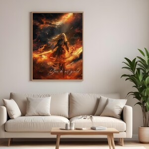 May include: A digital painting of a woman with long blonde hair standing in a fiery orange and yellow sky. The woman is holding a sword and the text "You do not yield" is written in the bottom right corner of the image.