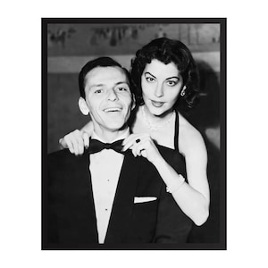 May include: A black and white photograph featuring Frank Sinatra and Ava Gardner. Sinatra wears a tuxedo with a bow tie, while Gardner wears a sleeveless dress, a necklace, and a bracelet. They are positioned close together in a formal portrait.