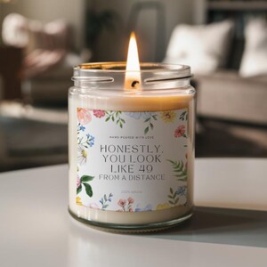 Funny 50th Birthday Candle – &quot;You Look Like 49 from a Distance&quot; – Floral Label, Handmade Gag Gift for Her, Scented Milestone Gift